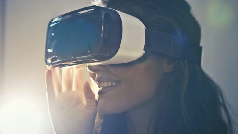 virtual reality marketing becoming the go to with the use of VR headsets, see woman using this technology